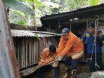 Ular-piton-sepanjang-4-meter-dievakuasi-dari-kandang-bebek-milik-warga-Jumat-612023.jpg