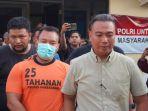 Zainal-Arifin-alias-Arif-tersangka-penganiayaan-kurir-JNT-memakai-baju-tahanan.jpg