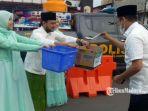 bupati-bangkalan-rk-abdul-latif-amin-imron-di-posko-peduli-korban-bencana-banjir.jpg