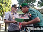 dandim-0829-bangkalan-letkol-kav-ari-setyawan-wibowo-nerima-kue-hut-74-tni-dari-kapolres-bangkalan.jpg
