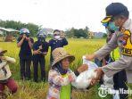 kapolres-sumenep-akbp-deddy-supriadi-bagikan-paket-sembako-dan-masker-pada-buruh-tani.jpg