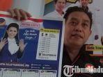 ketua-bawaslu-kota-madiun-kokok-heru-purwoko-dan-kalender-caleg-partai-nasdem-ratna-listy.jpg