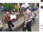 video-viral-pria-banting-motor-dan-tak-mau-dipegang-polisi-karena-ditilang-di-jalan.jpg
