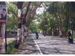 Baliho-caleg-terpaku-dipohon-di-ruas-jalan-Poros-Bissappu.jpg