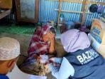 Baznas-Maros-menyalurkan-bantuan-kepada-penerima-zakat-di-Maros.jpg
