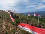 Brimob-dan-Brigif-11-Parepare-bentangkan-bendera-raksasa-ukuran-77-meter-di-bukit-teletabis.jpg