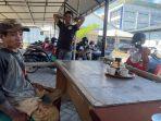 Dg-Bustan-45-mandor-tulang-jagal-hewan-qurban-musiman-asal-Mariso.jpg