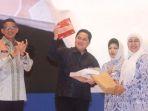 Erick-Thohir-dan-Sandiaga-Uno-dalam-Rakernas-IWAPI-2022.jpg