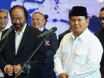 Ketua-Umum-Partai-Nasdem-Surya-Paloh-bersama-Calon-Presiden-Prabowo-Subianto-memberikan-ke.jpg