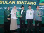 Sekretaris-Jendral-PBB-Mohammad-Masduki-menyerahkan-surat-dukungan-Suhartina-Bohari.jpg