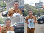 Staf-Humas-DPRD-Kota-Makassar-ATN-saat-keluar-dari-kantor-sementara-Kejari-Makassar.jpg