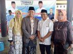 andi-muliana-sam-baju-coklat-dan-suaminya.jpg