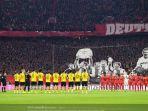 borussia-dortmund-dengan-seragam-kuningnya-dan-bayern-muenchen-yang-berkostum-merah.jpg