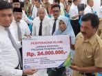 bupati-gowa-adnan-purichta-ichsan-menyerahkan-santunan-ahli-waris.jpg