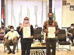 bupati-luwu-utara-indah-putri-indriani-kiri-bersama-ketua-dprd-luwu-utara-basir2.jpg