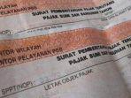 ilustrasi-sppt-pajak-bumi-dan-bangunan-282021.jpg