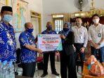 kepala-dinas-pmd-gowa-muh-asrul-menerima-santunan-kematian-aparatur-bpd.jpg