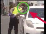 onkum-polisi-ludahi-pengendara-mobil-saat-sedang-lakukan-aksi-pungli.jpg