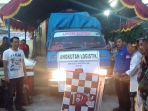 pelepasan-logistik-perdana-di-halaman-kpu-luwu_20180624_202930.jpg