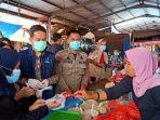 pom-palopo-memastikan-pangan-segar-yang-dijual-di-pasar-wawondula-aman.jpg