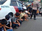 puluhan-pelaku-balapan-liar-di-jl-metro-tanjung-bunga.jpg