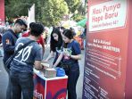 staf-mempromosikan-kartu-perdana-terbaru-smartfren-4g-di-area-cfd-pantai-losari-makassar_20181001_093037.jpg