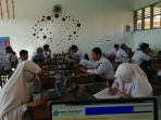 ujian-sekolah-berstandar-nasional-usbn-di-sman-7-makassar_20180319_150104.jpg