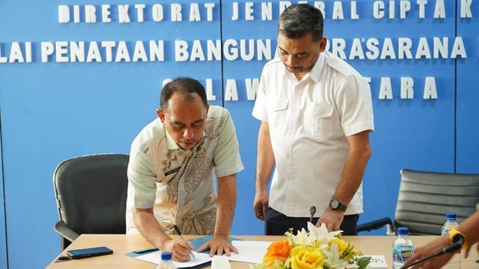 Bupati-Bolmong-Yusra-Alhabsyi-menandatangani-nota-kesepakatan-pembangunan-SPAM.jpg