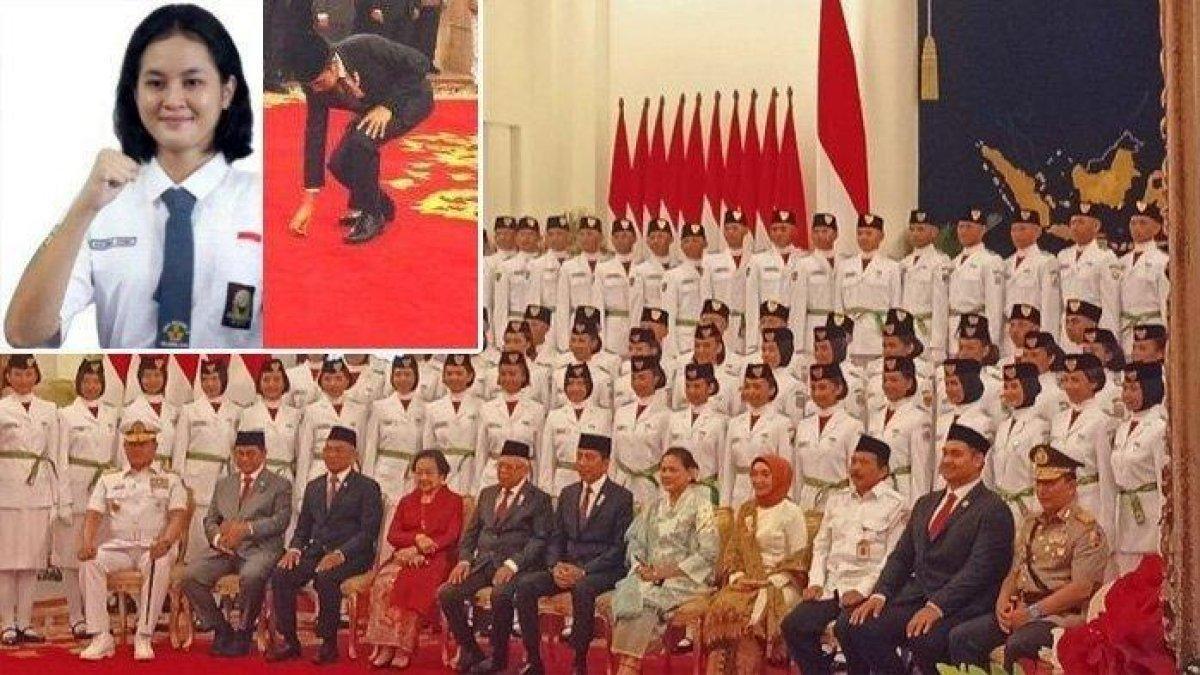Presiden-Joko-Widodo-saat-berjongkok-mengambilkan-pin-pengukuhan-paskibraka-yang-terjatuh.jpg