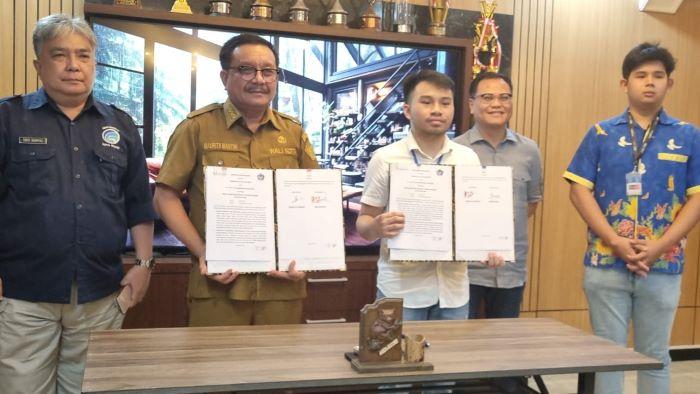 Wali-Kota-Bitung-Maurits-Mantiri-melakukam-penandanganan-MoU-dengan-PT-PC24-Telekomunikasi-Indonesia.jpg