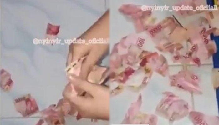 viral-video-seorang-wanita-robek-uang-aksinya-dikecam-warganet.jpg