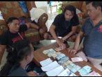 Barang-bukti-uang-yang-ditemukan-oleh-Polresta-Manado-fgjfgjhgjghj.jpg