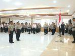 Caption-Upacara-korps-raport-laporan-kenaikan-pangkat-2-pejabat-Polda-Sulut.jpg