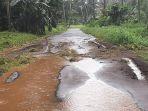 Curah-hujan-yang-tinggi-tersebut-membuat-sebagian-Jalan-Mokosondoy.jpg