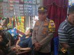 Foto-fis-Kapolsek-Dimembe-dan-Jajaran-saat-bersama-keluarga-yang-menolak-autopsi.jpg
