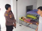 Kapolsek-Mapanget-Iptu-Gusti-Ayu-saat-melakukan-pemeriksaan-kepada-korban-di-TKP-HGFHFGH.jpg