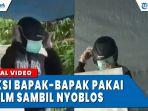 aksi-bapak-bapak-pakai-helm-sambil-nyoblos-fgyh.jpg
