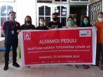 alfamidi-menyerahkan-donasi-konsumen-kamis-24122020.jpg