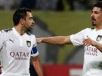 baghdad-bounedjah-kanan-saat-merayakan-gol-bersama-xavi-hernandez.jpg