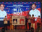 ketua-dpk-pkpi-bitung-superman-boy-gumolung-ketua-dpd-nasdem-bitung-norry-supit.jpg