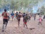 kkb-papua-bertamu-ke-papua-nugini-bertemu-keluarga-pulang-bawa-senjata.jpg