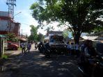 lo-panitia-sibuk-mengatur-kedatangan-peserta-yang-menggunakan-kendaraan.jpg