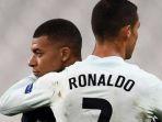 megabintang-timnas-portugal-cristiano-ronaldo-berpelukan-pemain-timnas-perancis-kylian-mbappe.jpg
