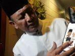 menkopolhukam-wiranto-menunjukkan-foto-kenangan-dirinya-bersama-almarhum-cucunya.jpg