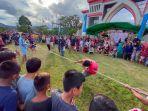 para-peserta-lomba-tarik-tambang-sedang-bertanding.jpg