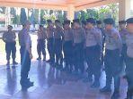 personel-polda-sulut-yang-bertugas-di-polres-minsel-kembali-ke-manado.jpg