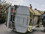 sejumlah-orang-berupaya-mengevakuasi-truk-yang-terlibat-kecelakaan-maut-di-turunan-sigar-bencah.jpg