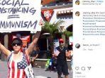 seorang-warga-pengunjuk-rasa-bentangkan-protes-terhadap-kebijakan-lockdown.jpg