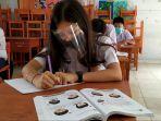 smp-negeri-4-kotamobagu-terapkan-covid-19.jpg
