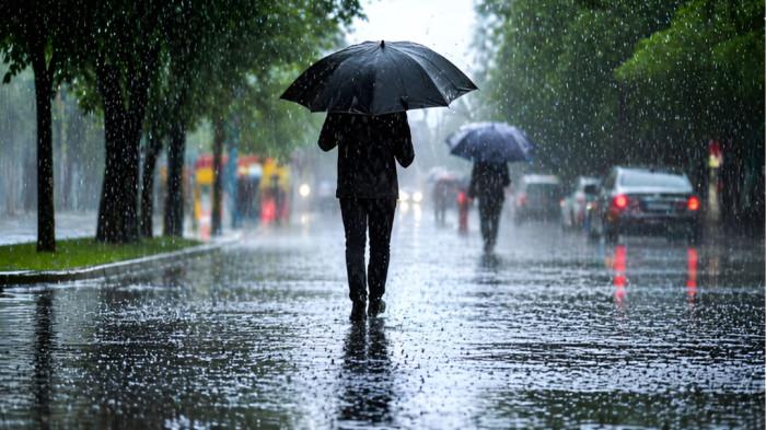 HUJAN LEBAT- Ilustrasi kondisi cuaca hujan lebat yang mengguyur sebuah kawasan perkotaan.